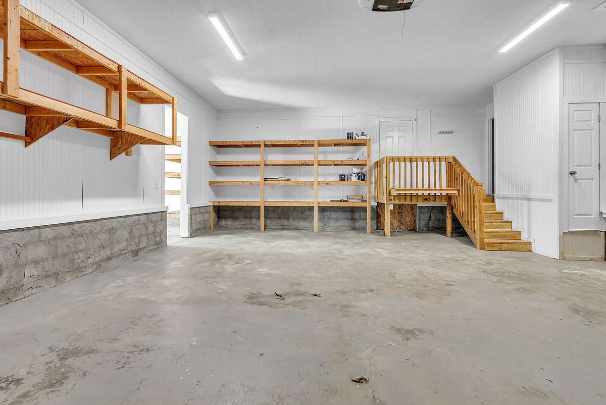 The 2 car garage that connects to the 3rd car garage which connects to the mother-in-law apartment.