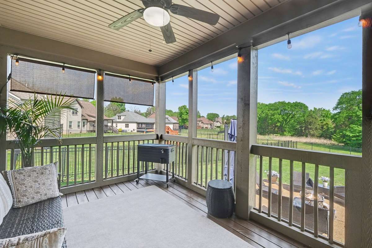 Screened in back porch for deer watching!! This lot backs up to greenery and wildlife make an appearance from time to time.