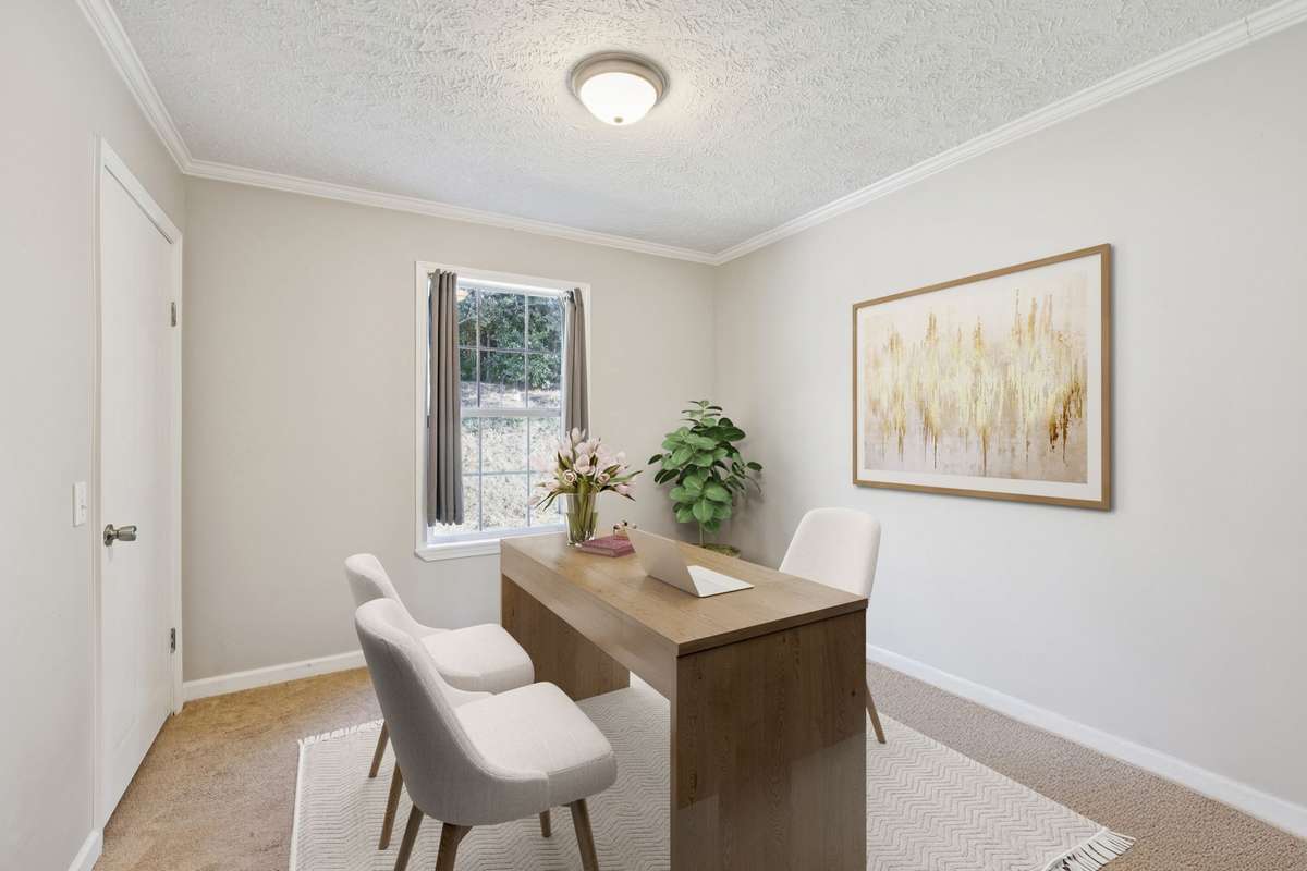 Spacious bedroom that can be turned into a bright and functional home office.