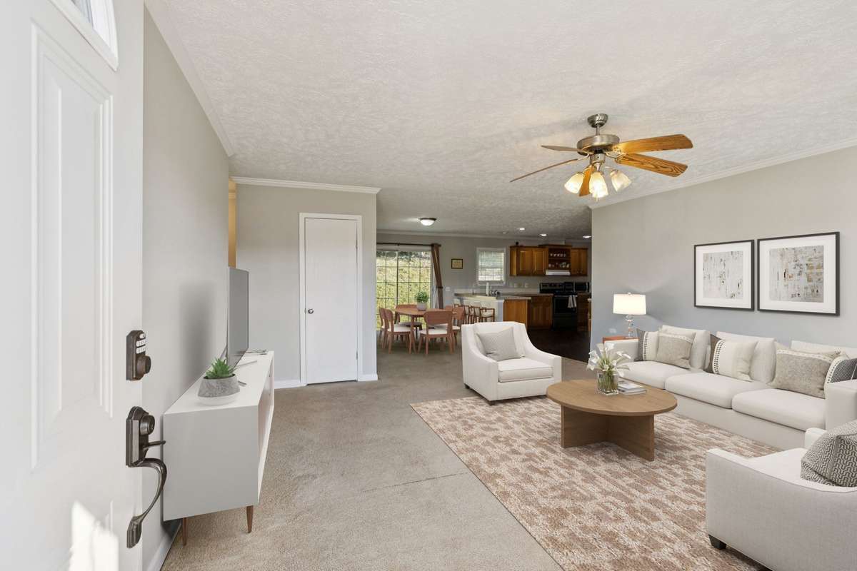 A bright and inviting living room that serves as the heart of the home, perfect for relaxing or entertaining guests.