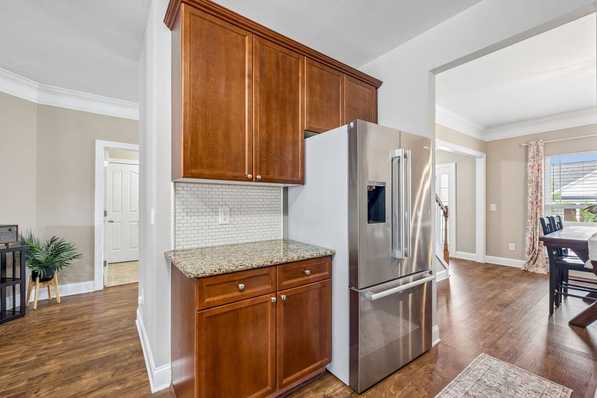 Tile Backsplash and wood grain cabinets