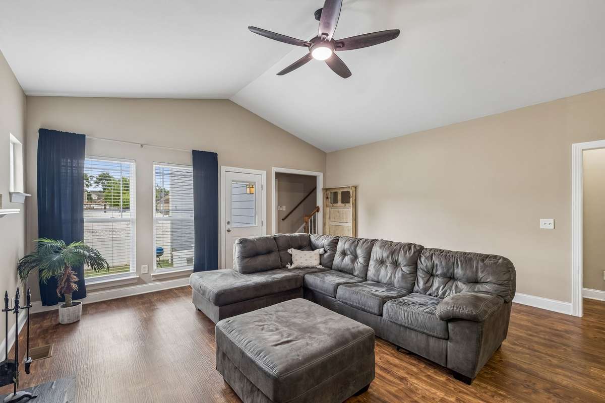 Living Room has vaulted ceilings and access to Back Yard