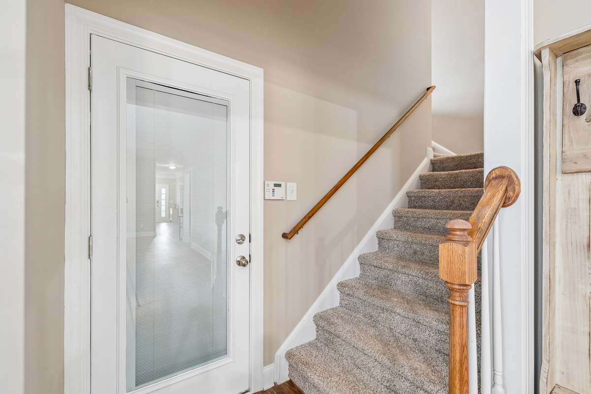 Door leads to garage and stairs to Bonus