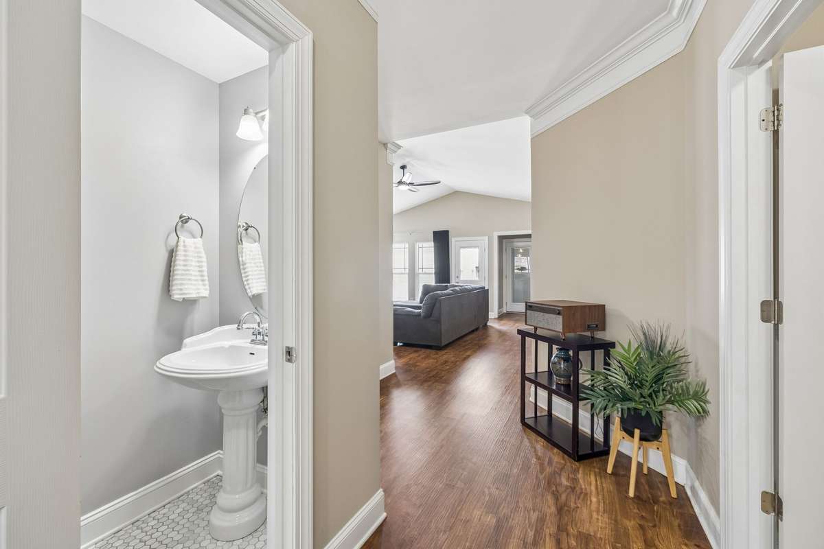 Half Bath with Tile Floor - located off living areas