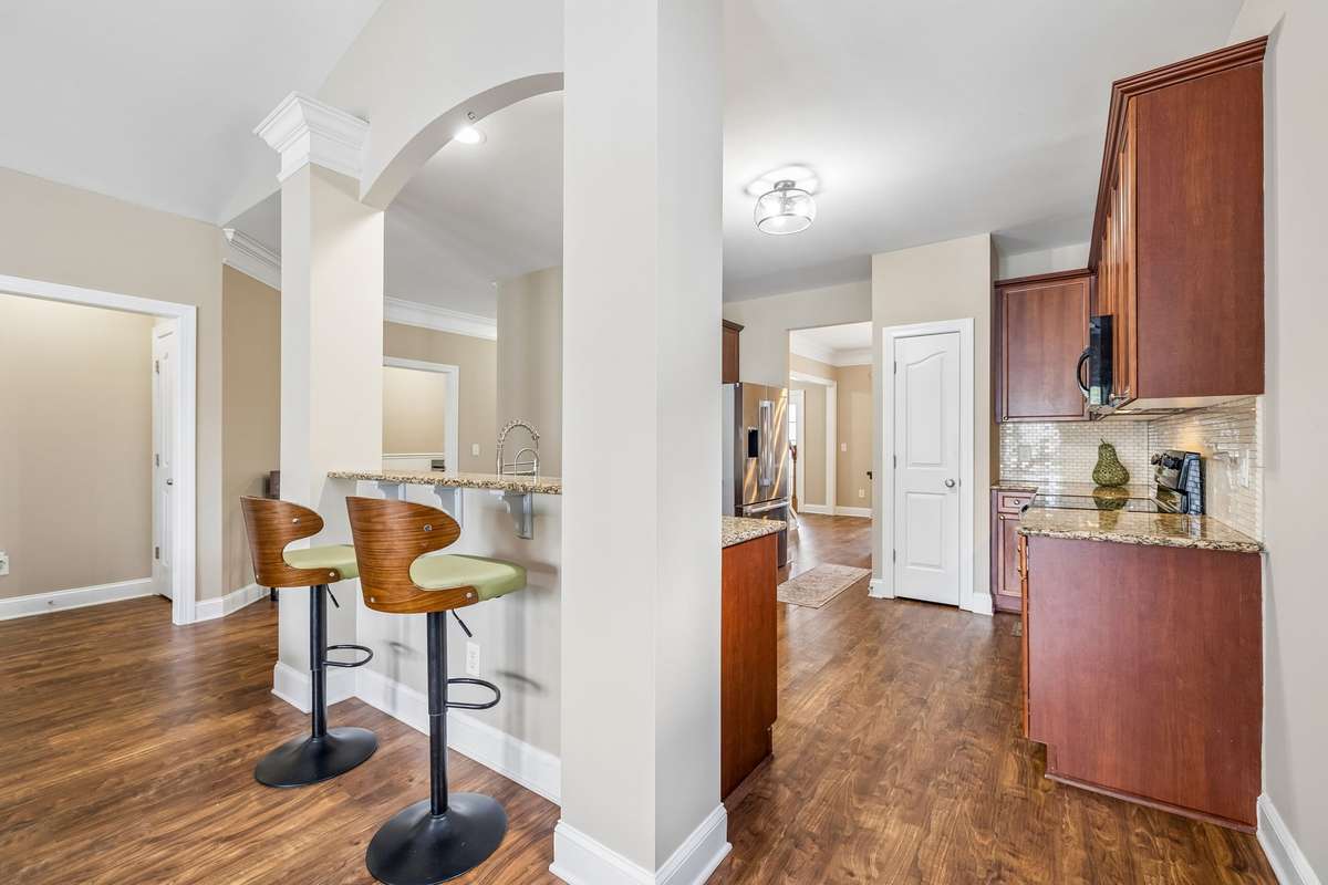 Large Open Kitchen with Pantry, Granite Countertops and bar area