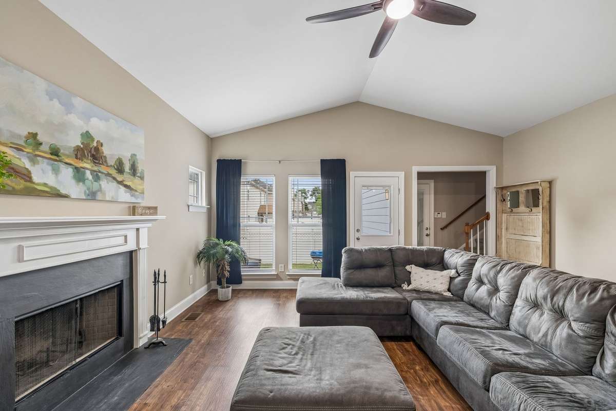 Living Room also has door to garage and stairs leading to private Bonus room