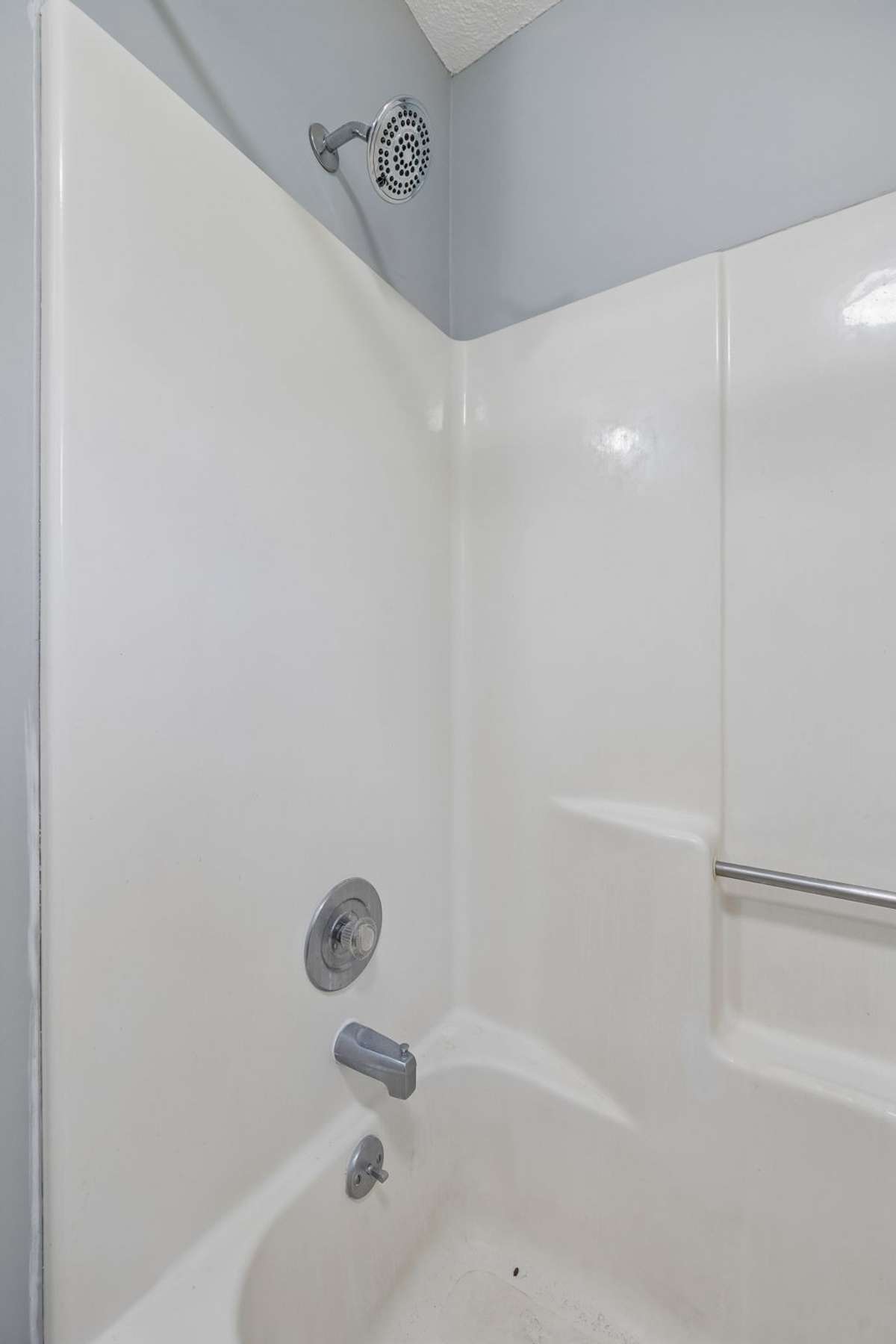 A close up of the second bathroom's tub/shower combination.