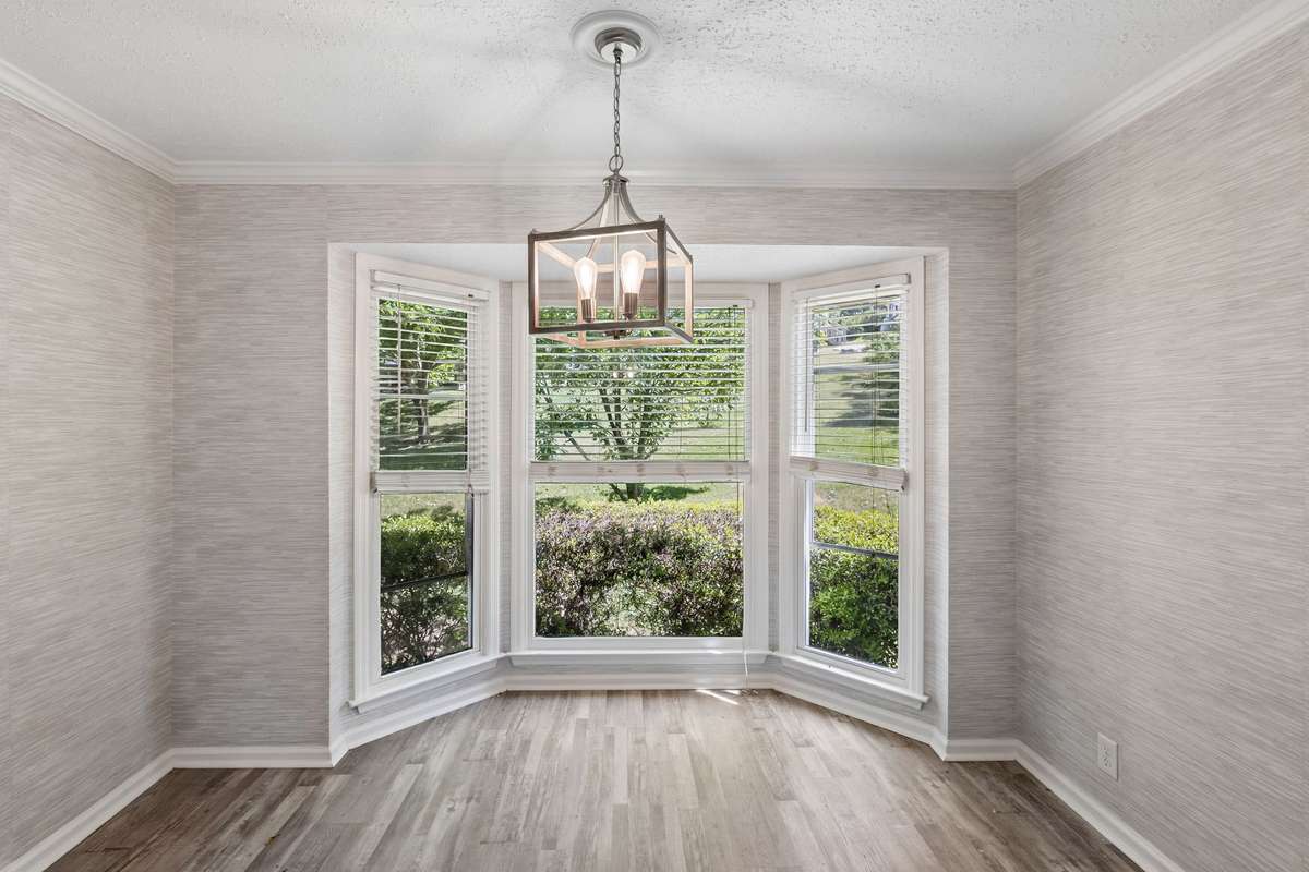 A closer view of the breakfast nook and its view into the backyard.