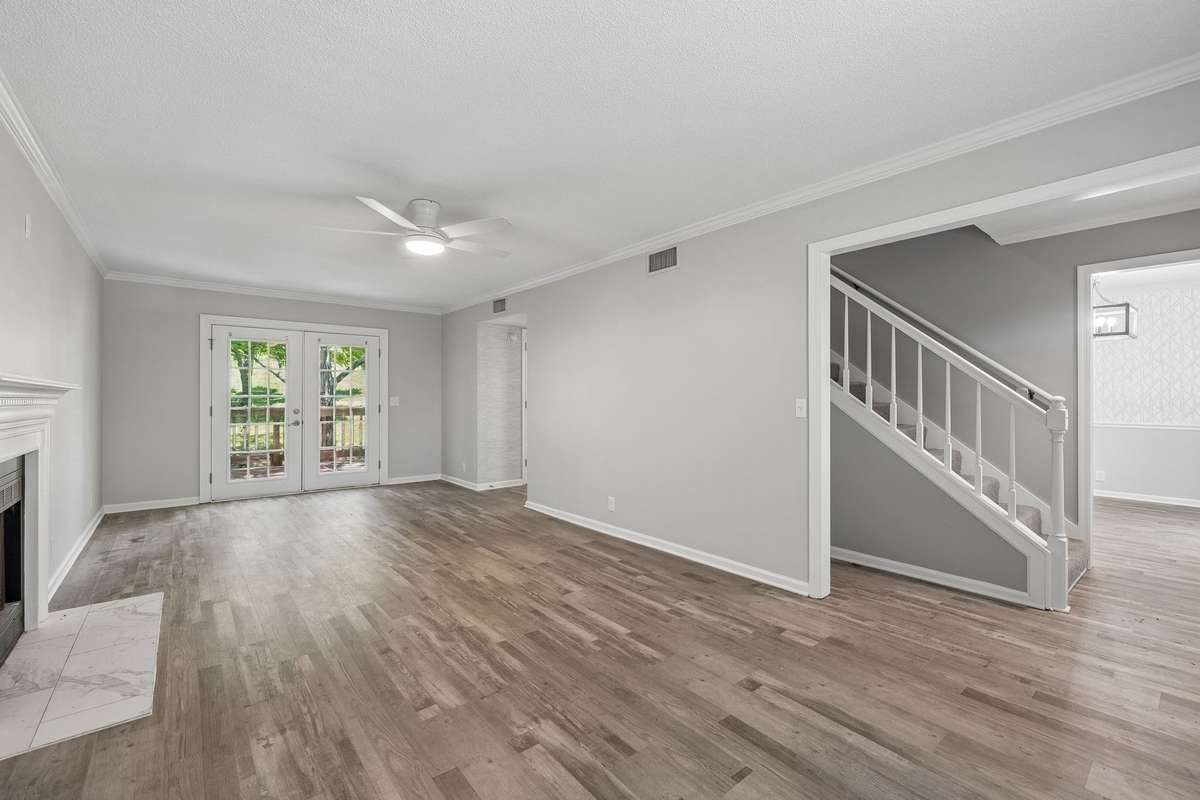 A view of the living room from the front of the house. The living room runs from the front of the house all the way to the rear of the house.