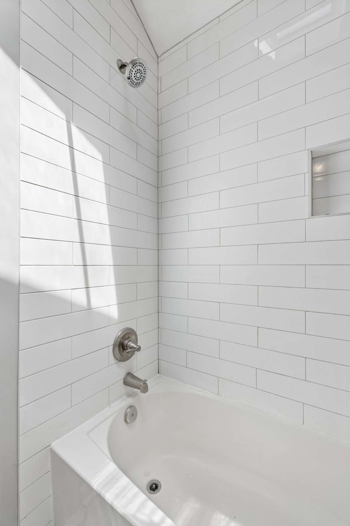 A close up of the tub/shower's subway tile.