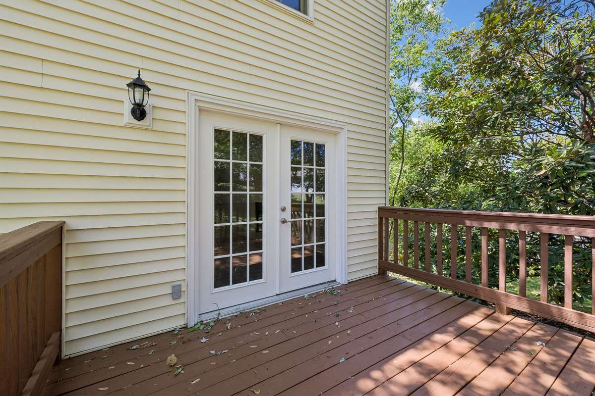 A closer view of the deck showing the French Doors leading into the home's living room.