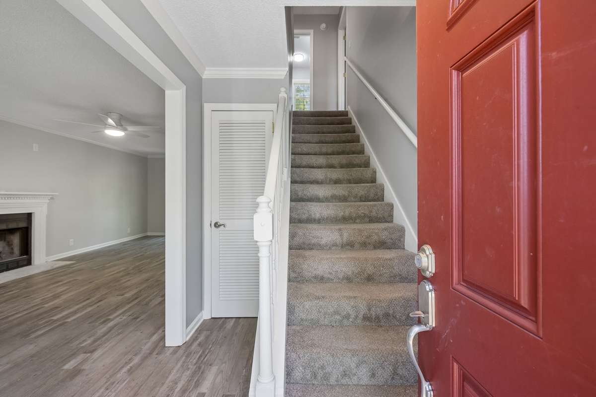 Once the front door opens, guests see a stairway leading to upstairs bedrooms, the living room on the left and the dining room to the right. The home was built in a classic center hall colonial style.