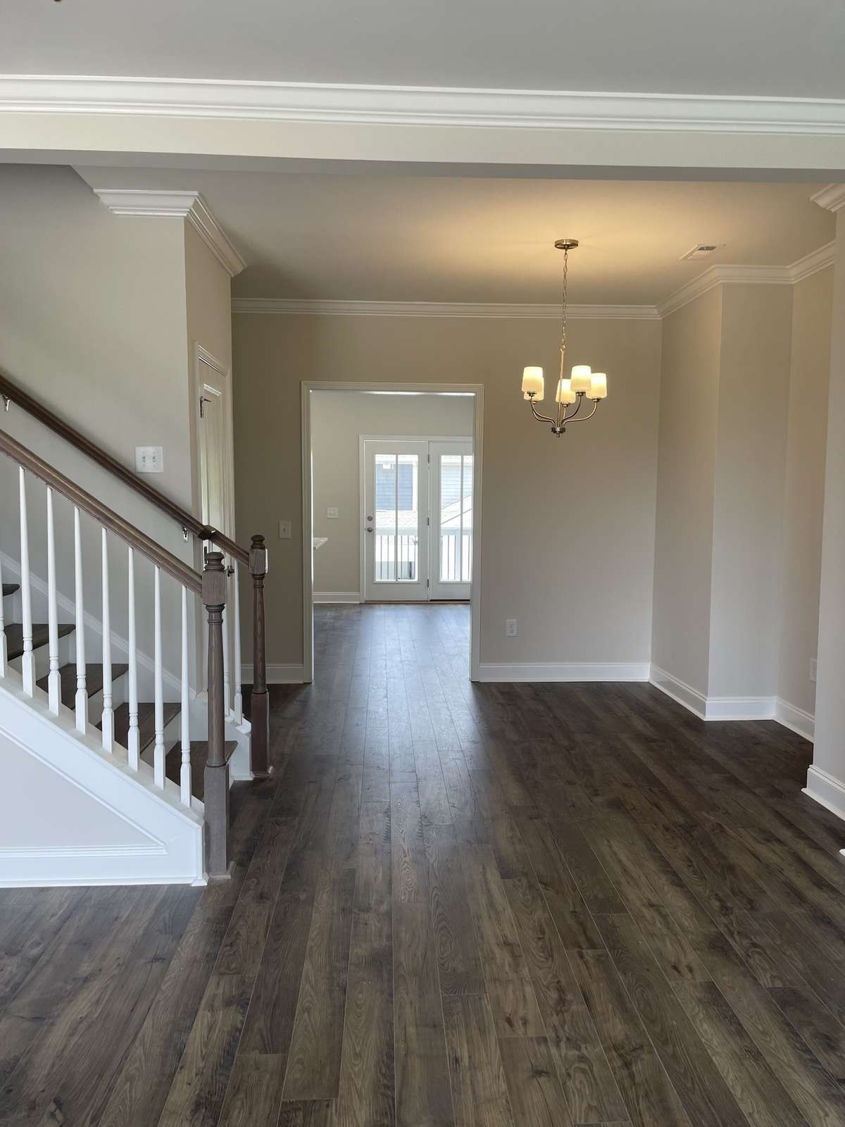Welcome home to your new townhome. 5.25" baseboards and crown moulding included on main first floor.  Laminate flooring.  Hardwood treads on all staircases.