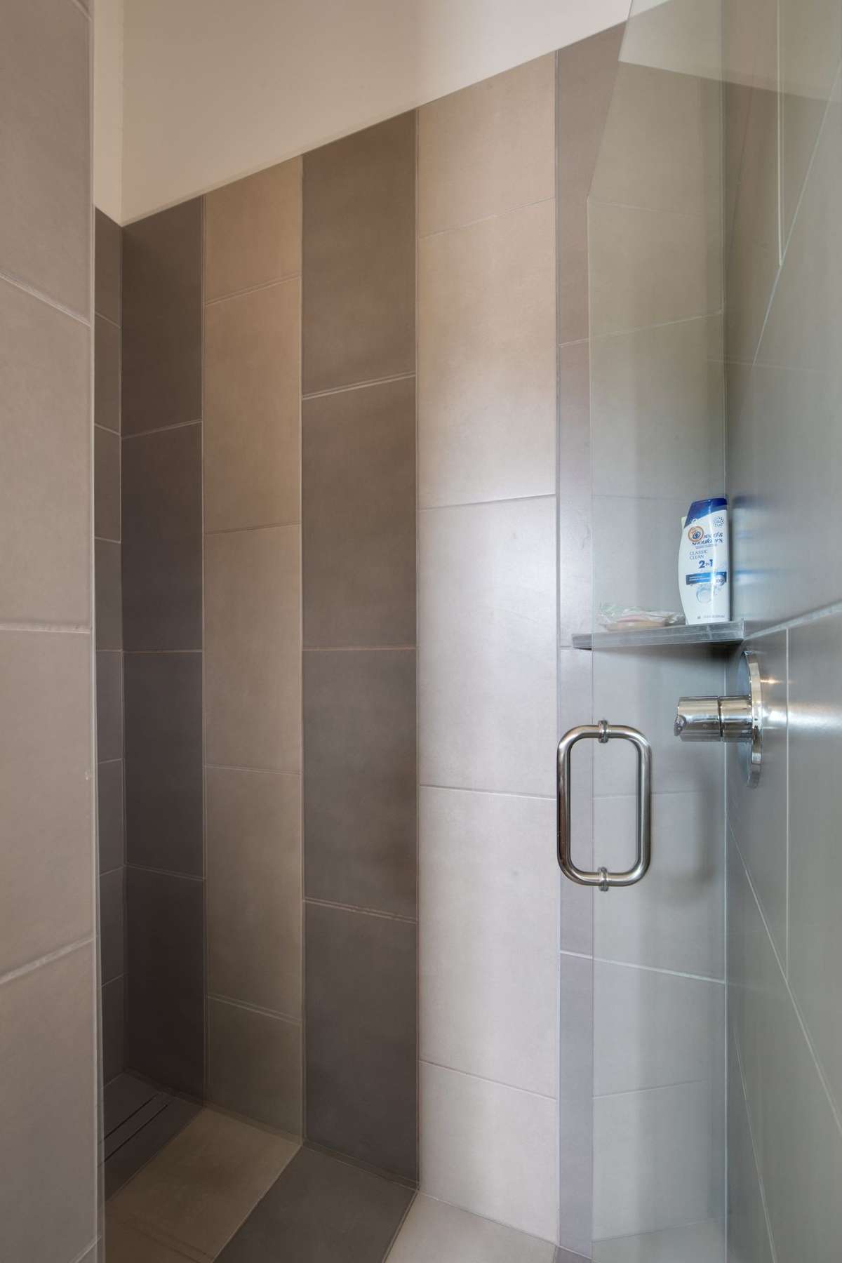 Tiled shower in primary bathroom.