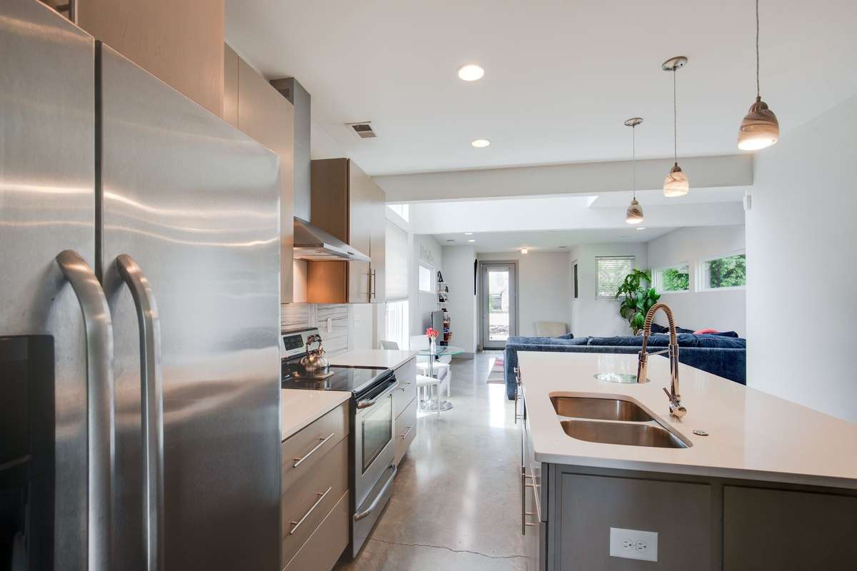 Kitchen refrigerator stays with the home.