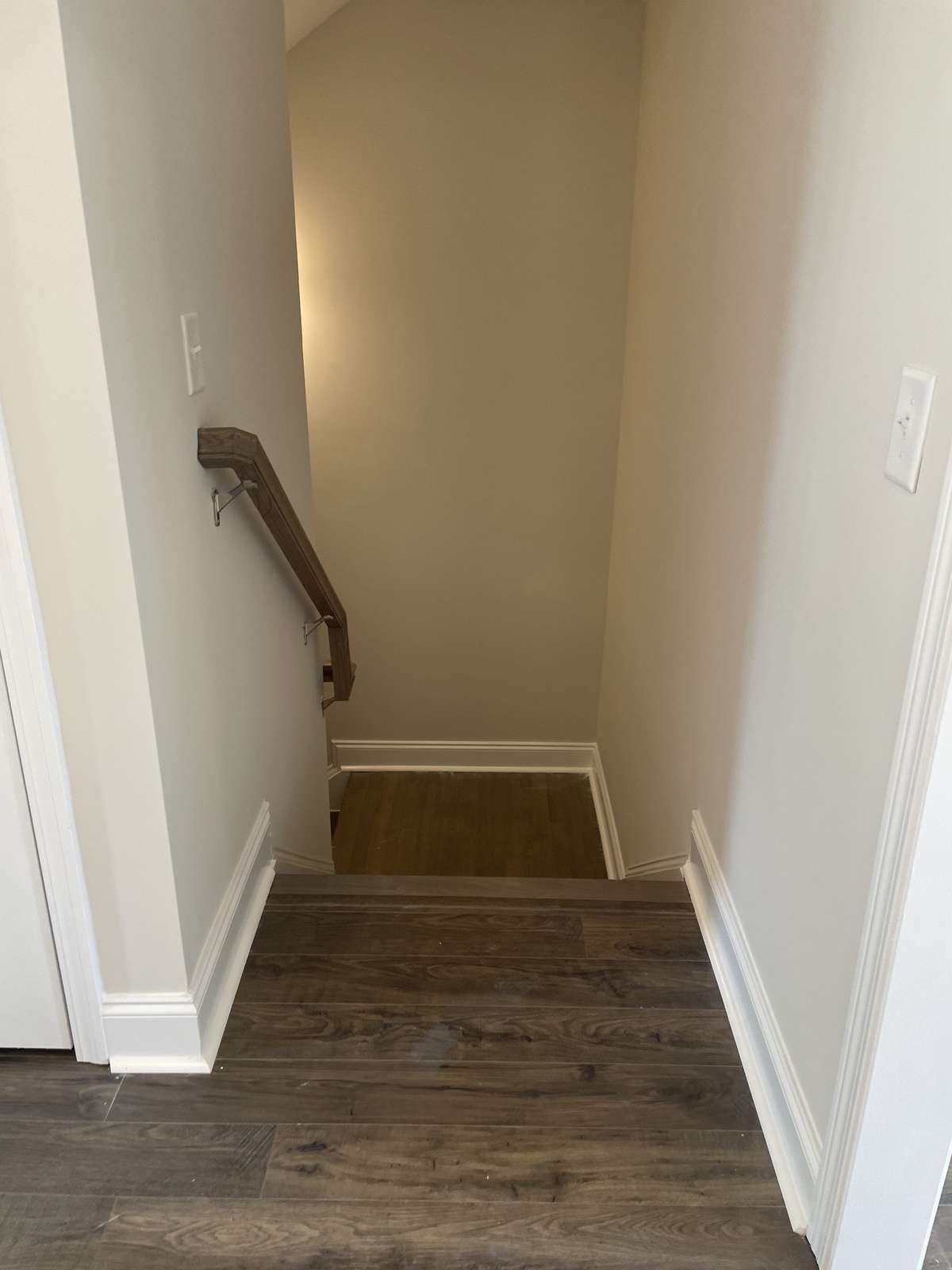 Downstairs leads to basement garage and flex space
