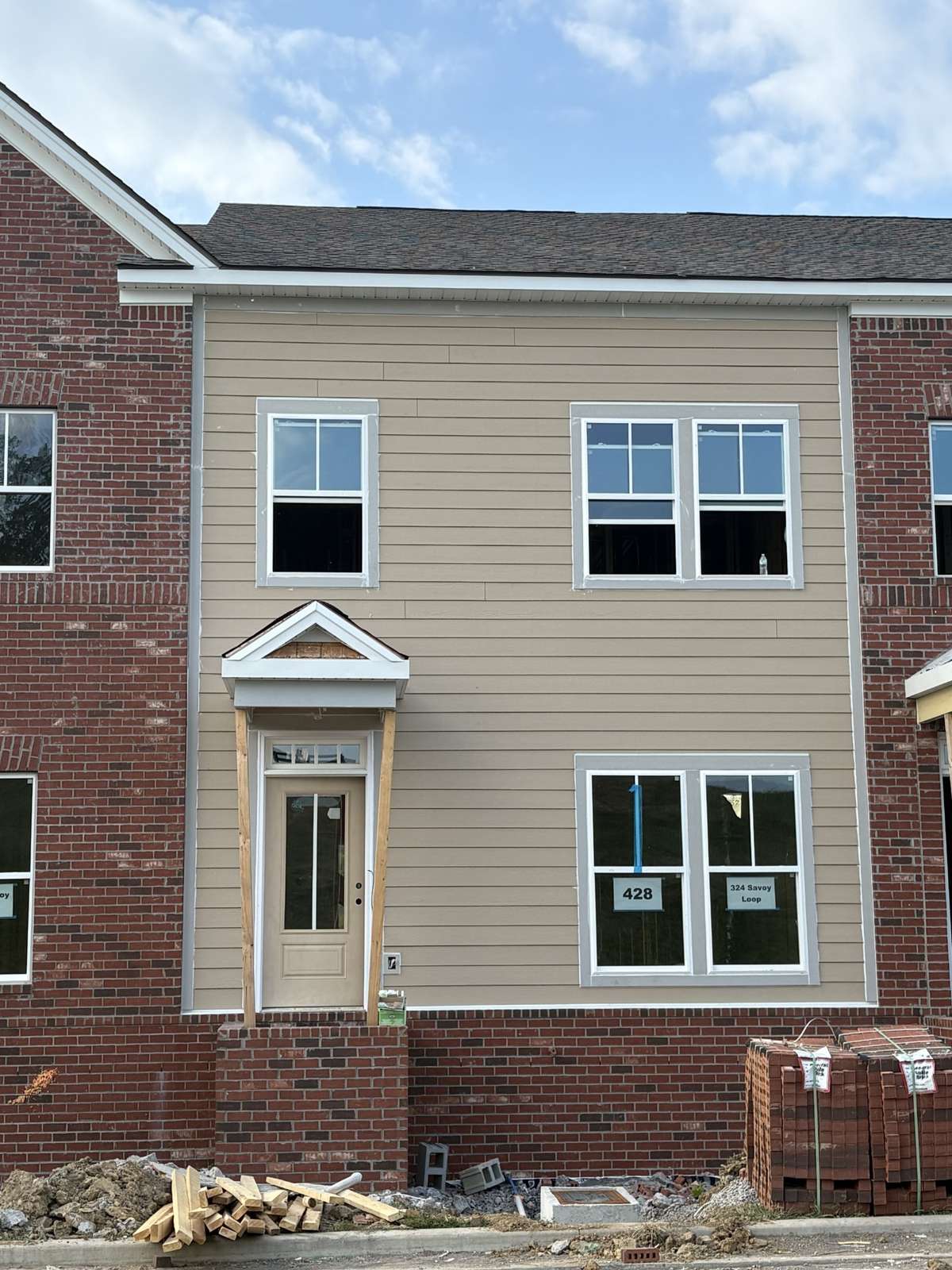 Actual exterior front.  All interior media are a previously built Highland and may show colors and options not available on this home.  Decorator color choices selected are listed in the documents tab
