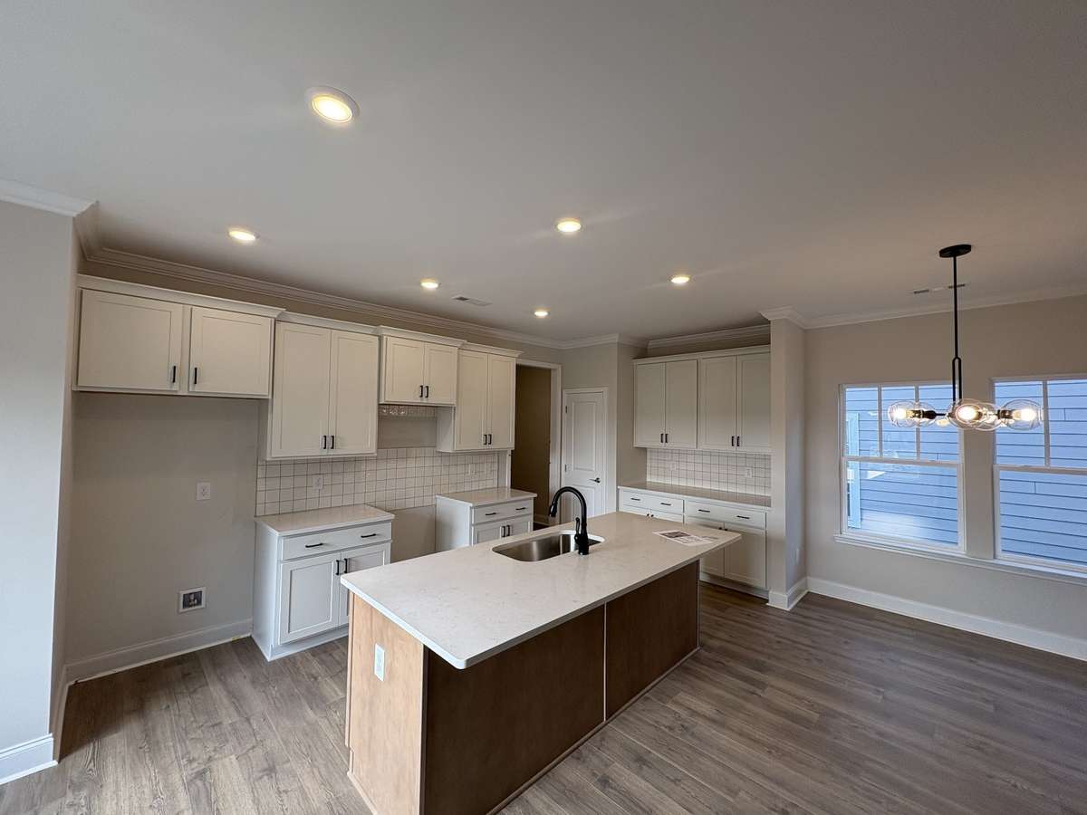 kitchen will include Whirlpool SS microwave, dishwasher and electric range.
