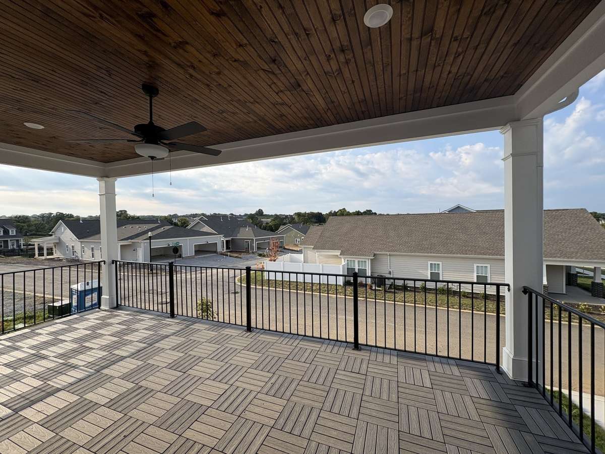 Covered rear deck.  2nd story deck offers views of the community.  Look at that gorgeous trex decking