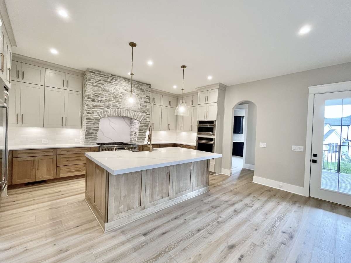 As you enter the gourmet kitchen, you're immediately struck by its sophisticated design, which maximizes every inch of available space to create a culinary oasis that is both stylish and practical.
