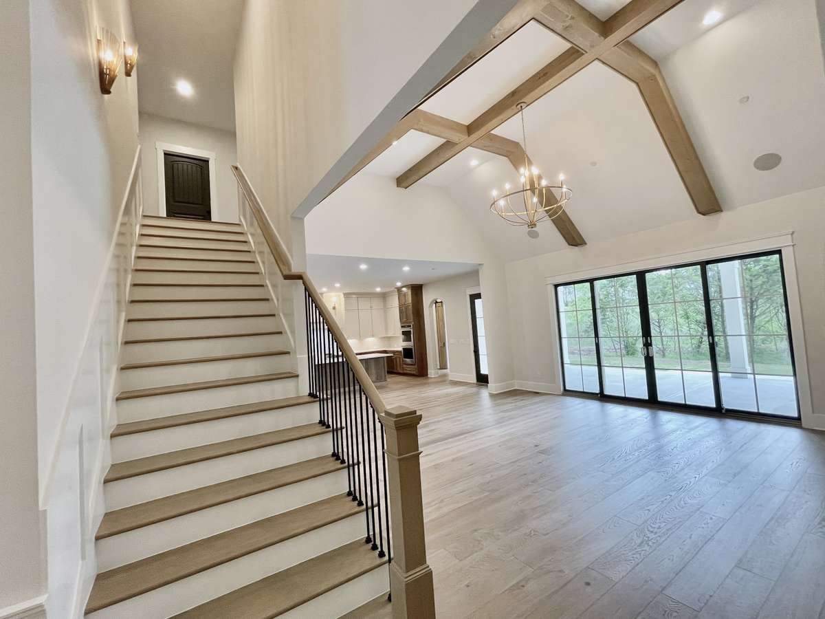 Ascend to the upper level to discover a spacious bonus recreation room, ideal for leisure activities and creating lasting memories with loved ones.
