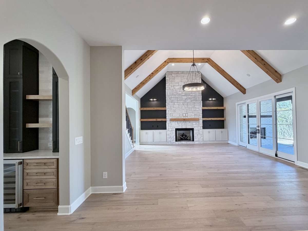 A centerpiece fireplace, flanked by built-in bookcases, adds warmth & character to the space. ALL Photos are of Similar Homes and NOT EXACT HOME.