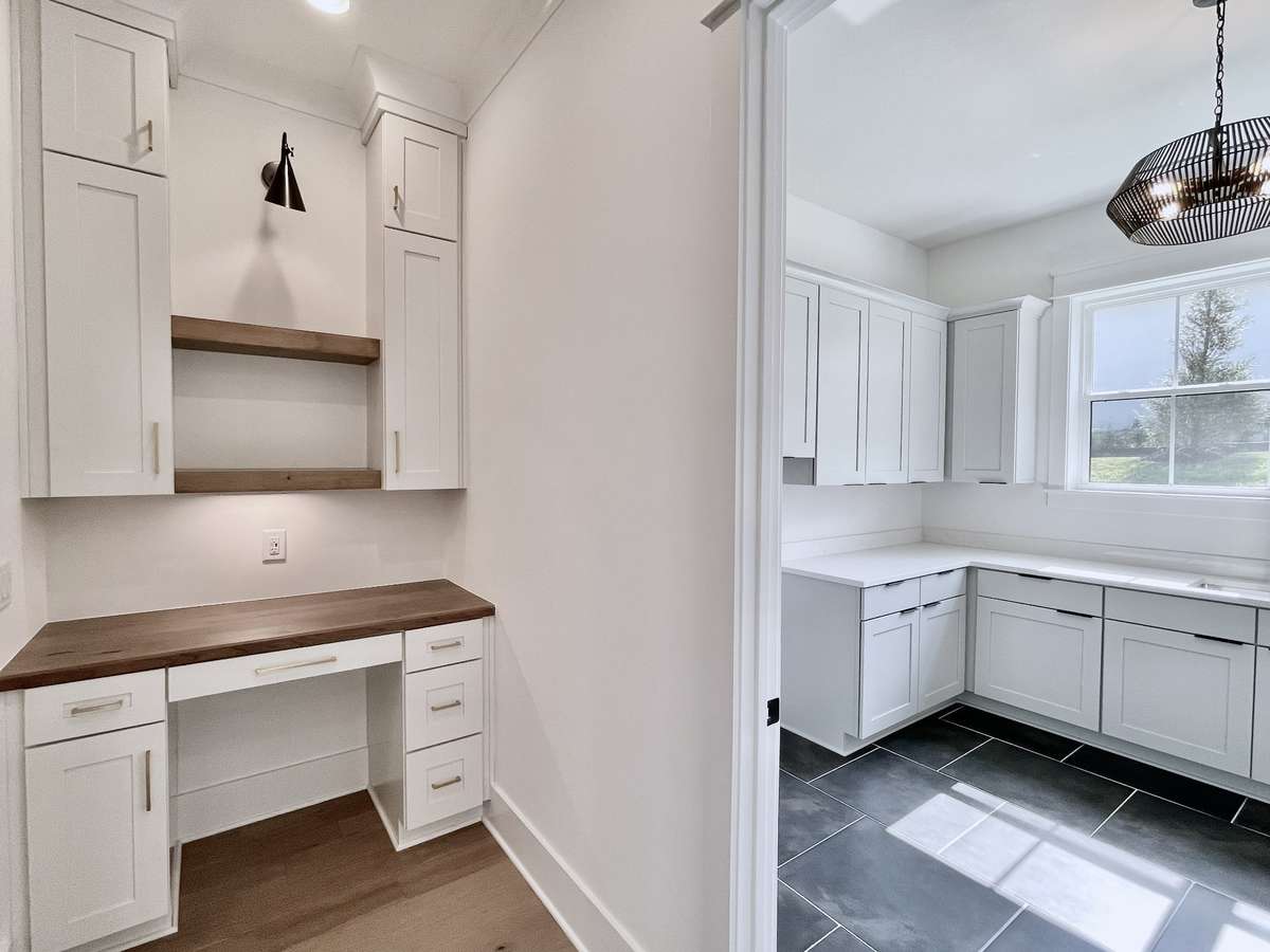 The built-in work station is indeed a productivity oasis within the home, offering a dedicated space where efficiency and organization thrive.