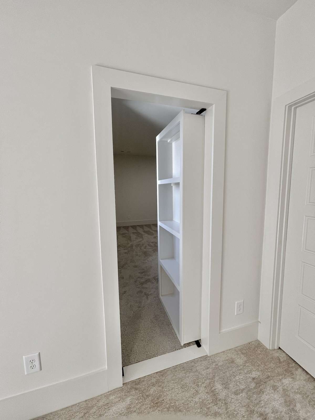 Spacious walk-in storage area with incredible potential. Finish the space to add square footage or create a hidden secret room—complete with a disguised bookcase door—or transform it into a safe room, playroom, hobby space, or home gym.