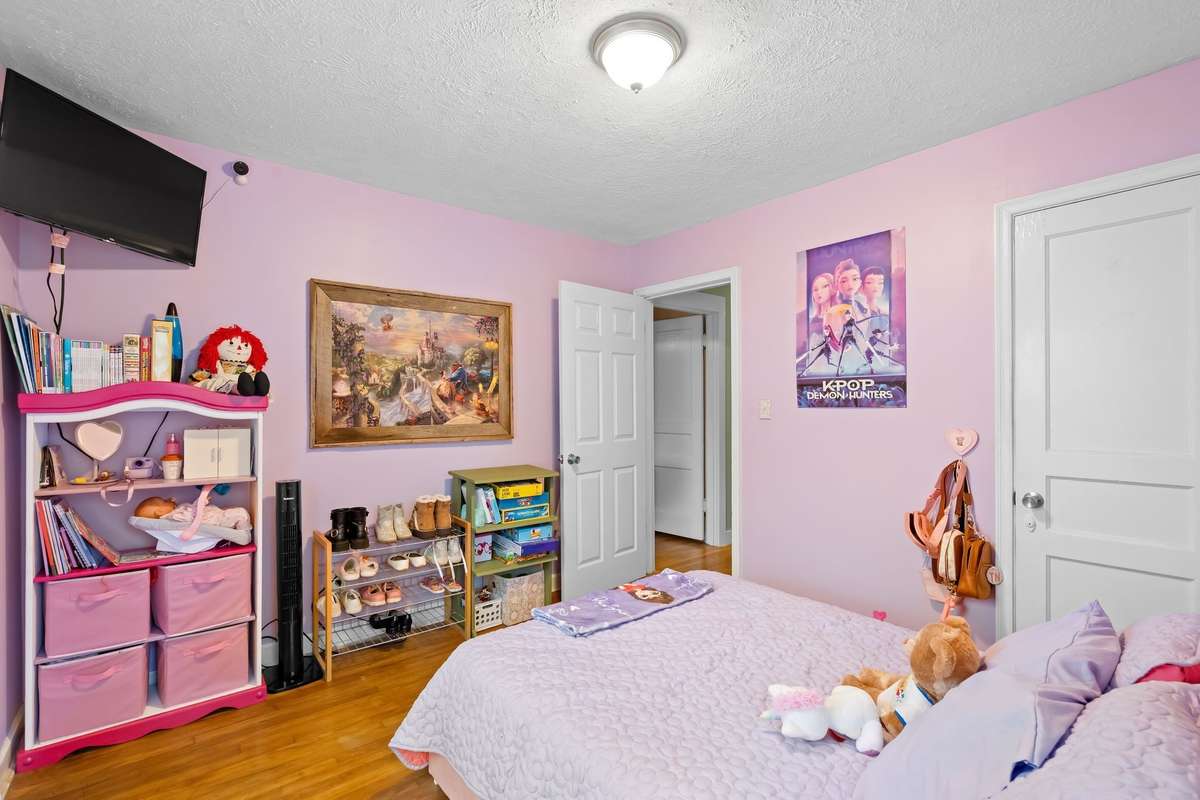 Spacious bedroom with original hardwood floors!