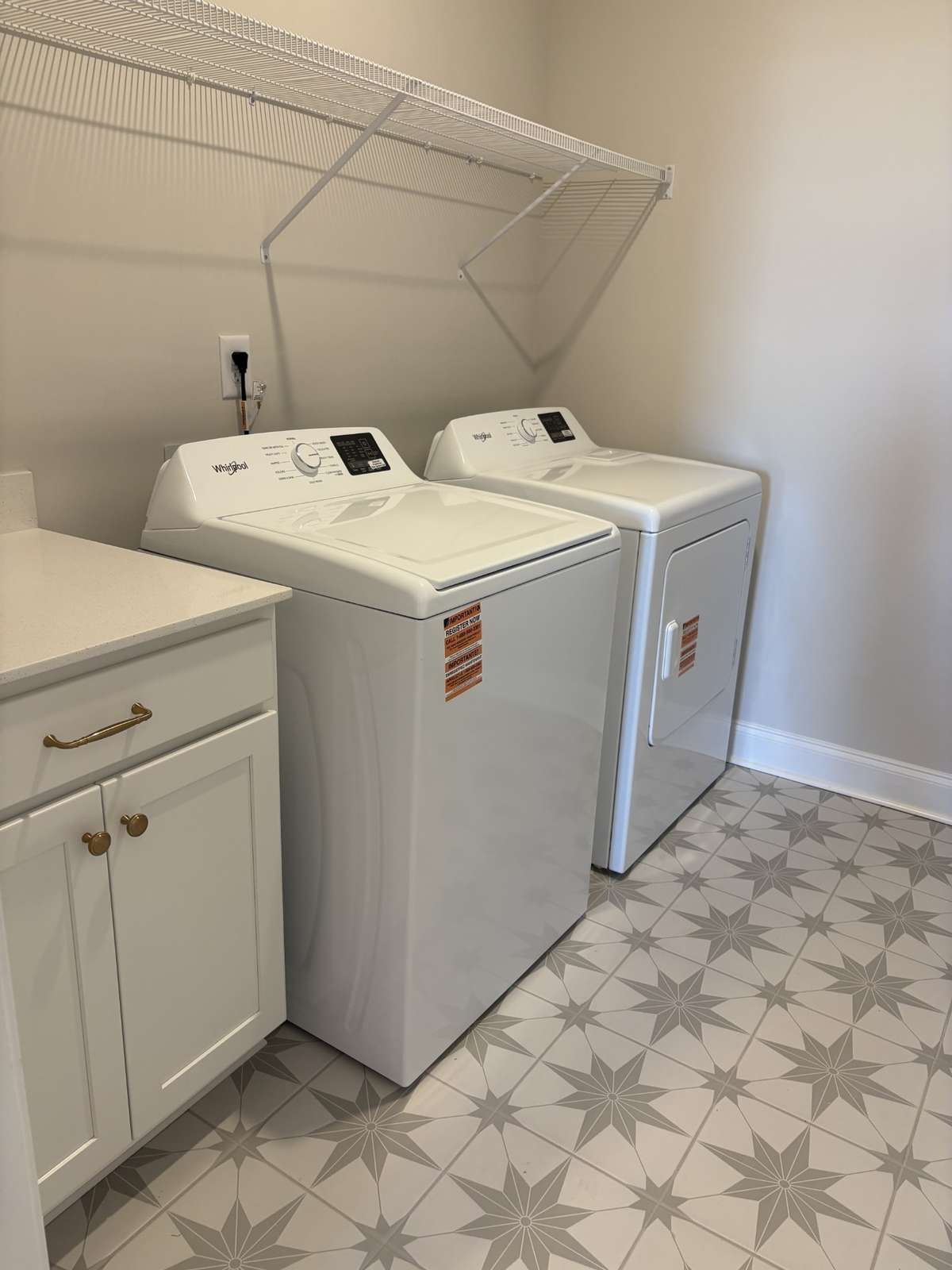 Walk In Laundry with folding cabinet.