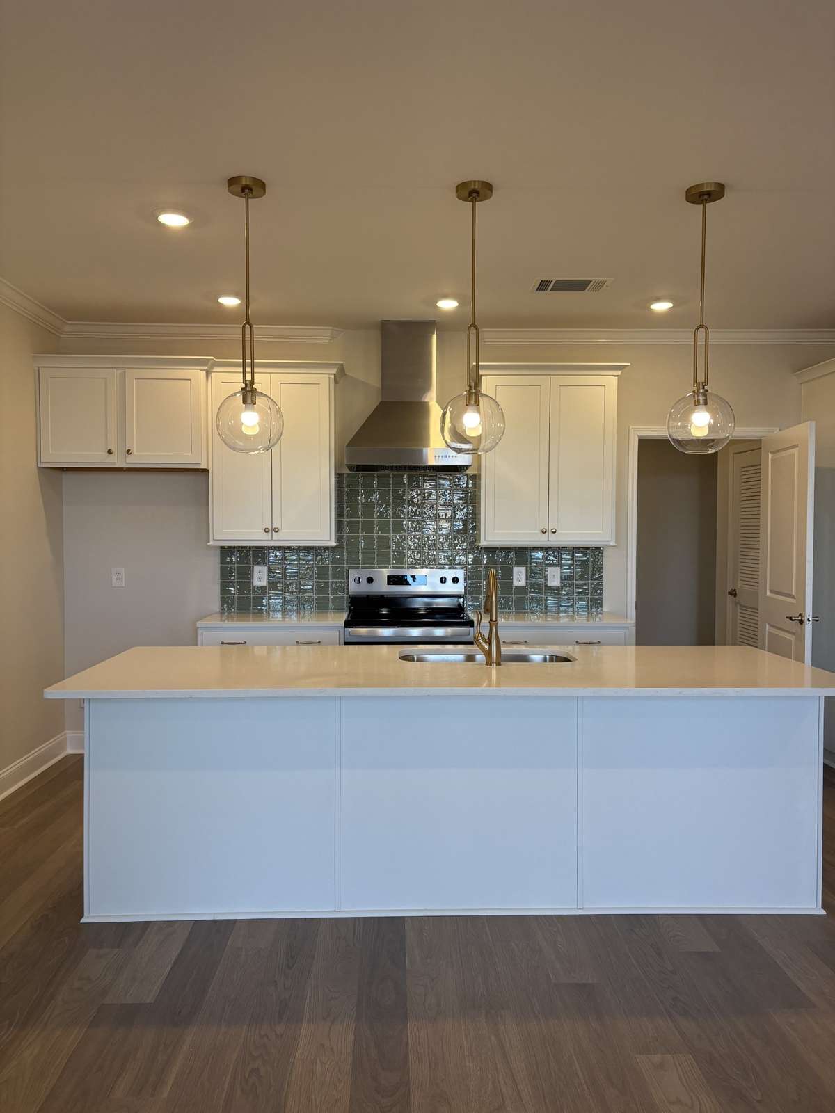 White Kitchen with green backsplash