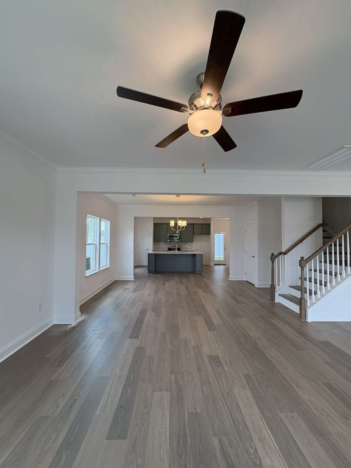 Family to Kitchen view.  Open concept plan.  (Not actual home so may show colors not being built in actual home)
