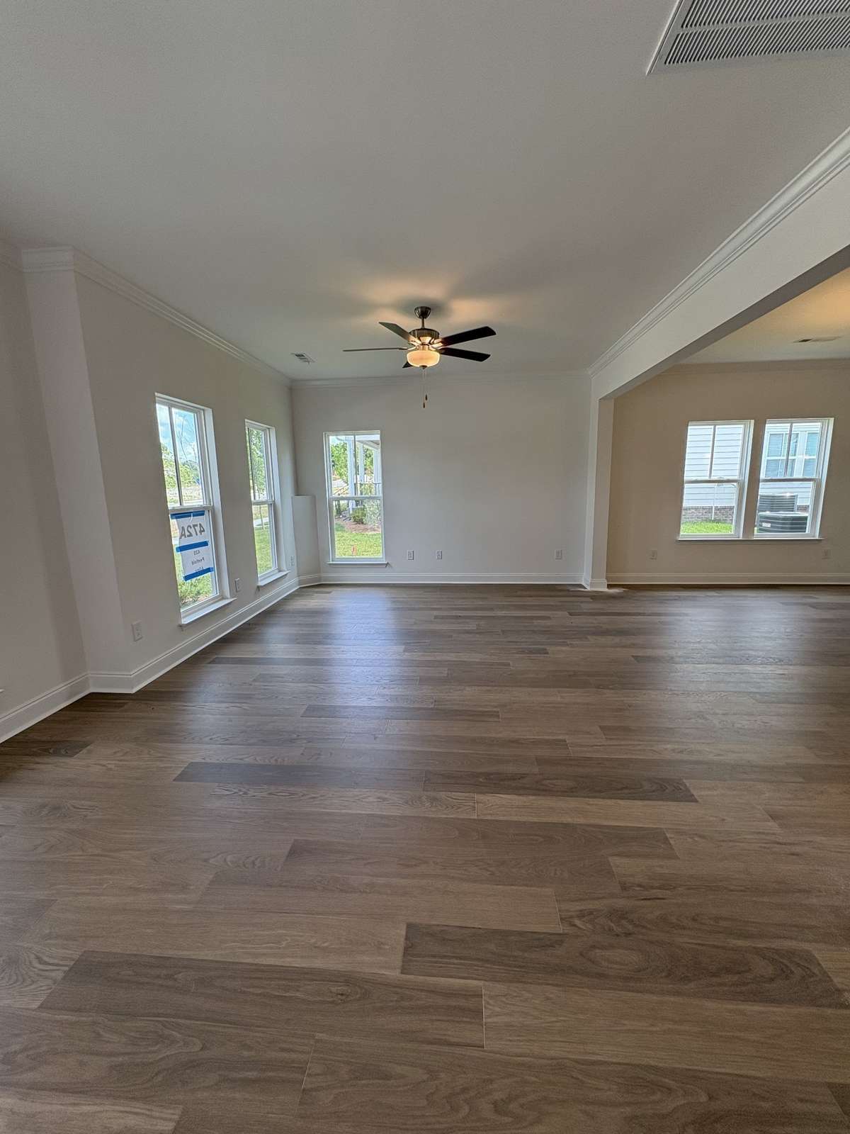 Family Room with foyer.  Lots of windows for natural lighting.  Crown molding on first floor main.