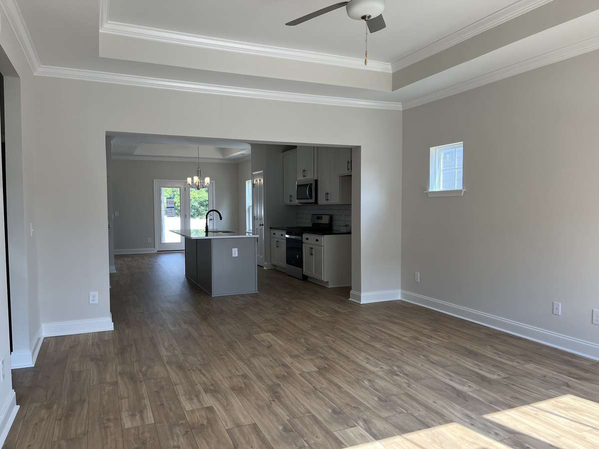 Family Room with Trey ceiling.  NOT ACTUAL HOME.  Colors and options shown may not be available in actual home built.