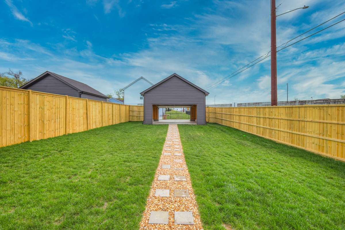 Huge back yard with alley parking.