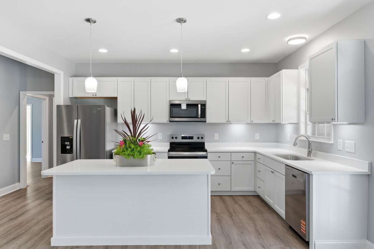 Gorgeous White Quartz Counters and SS Appliances