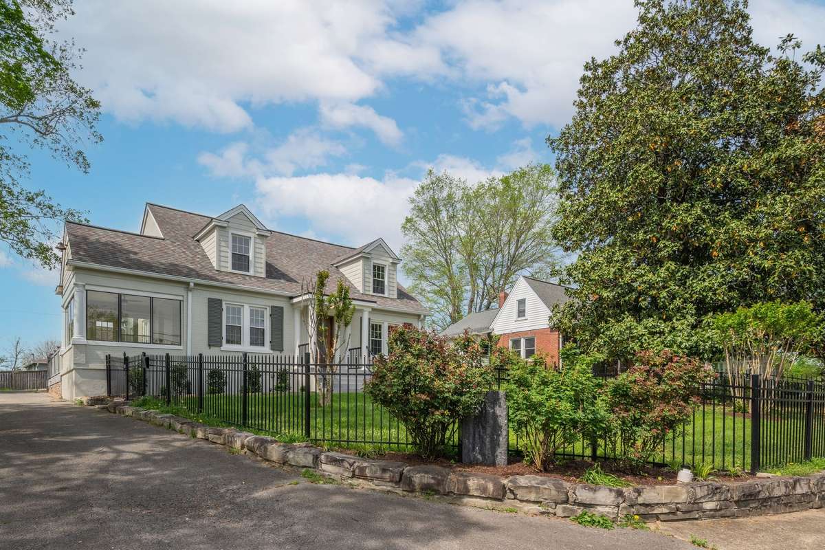 The Belle Meade of Downtown Dickson * Iron Fenced Front Yard Lined with Stone Accent Wall