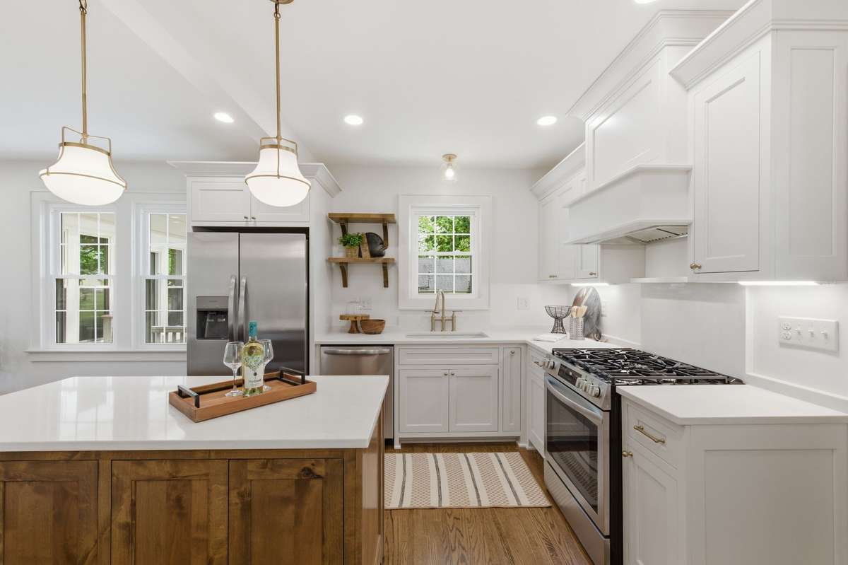 Custom Kitchen Designed by Molly Tittle Interiors along with all her Stunning Selections Throughout the House*Quartz Countertops are the icing on the cake !