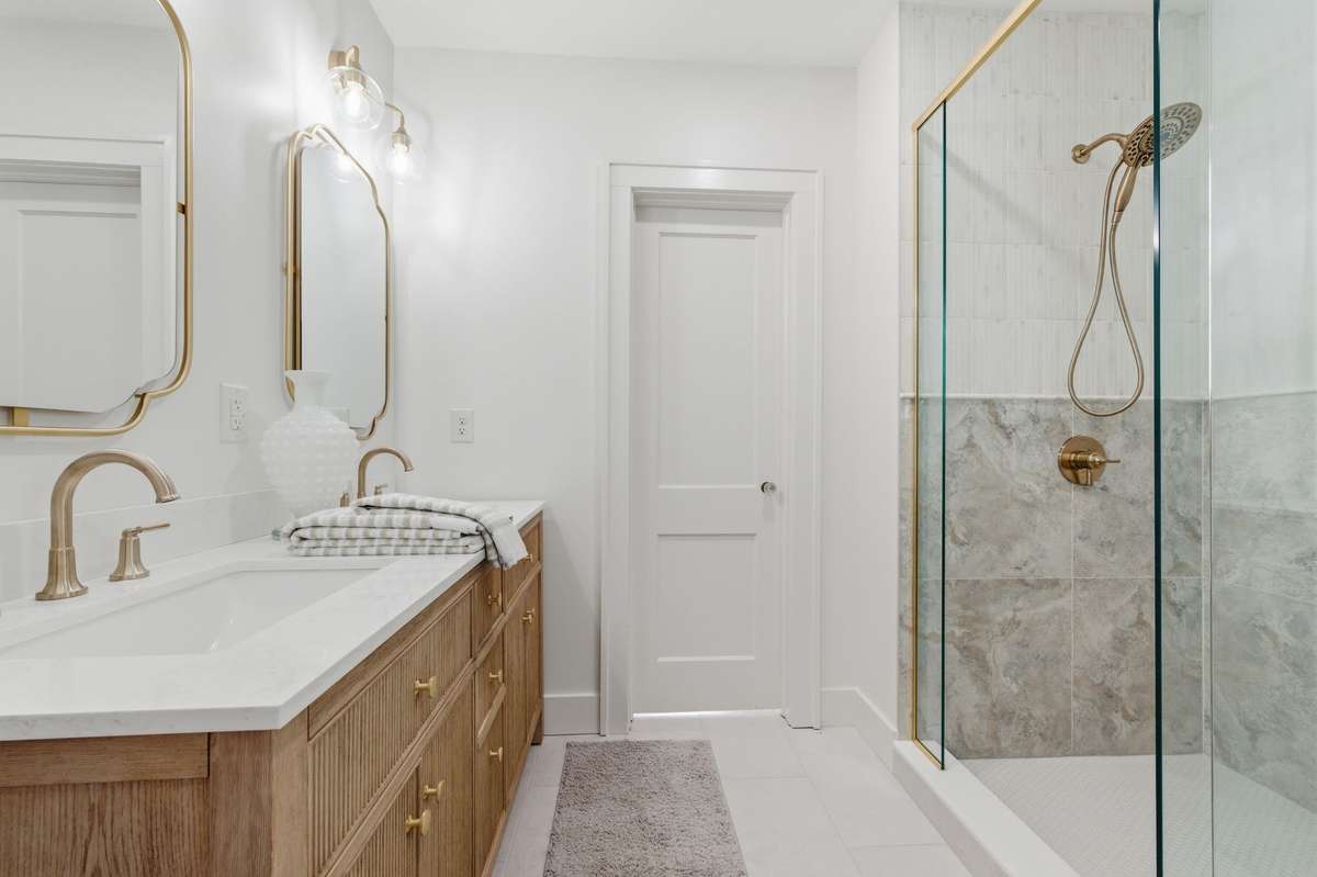Exquisite Double Vanity with Beautifully Detailed Mirrors *Upsized Tile Shower