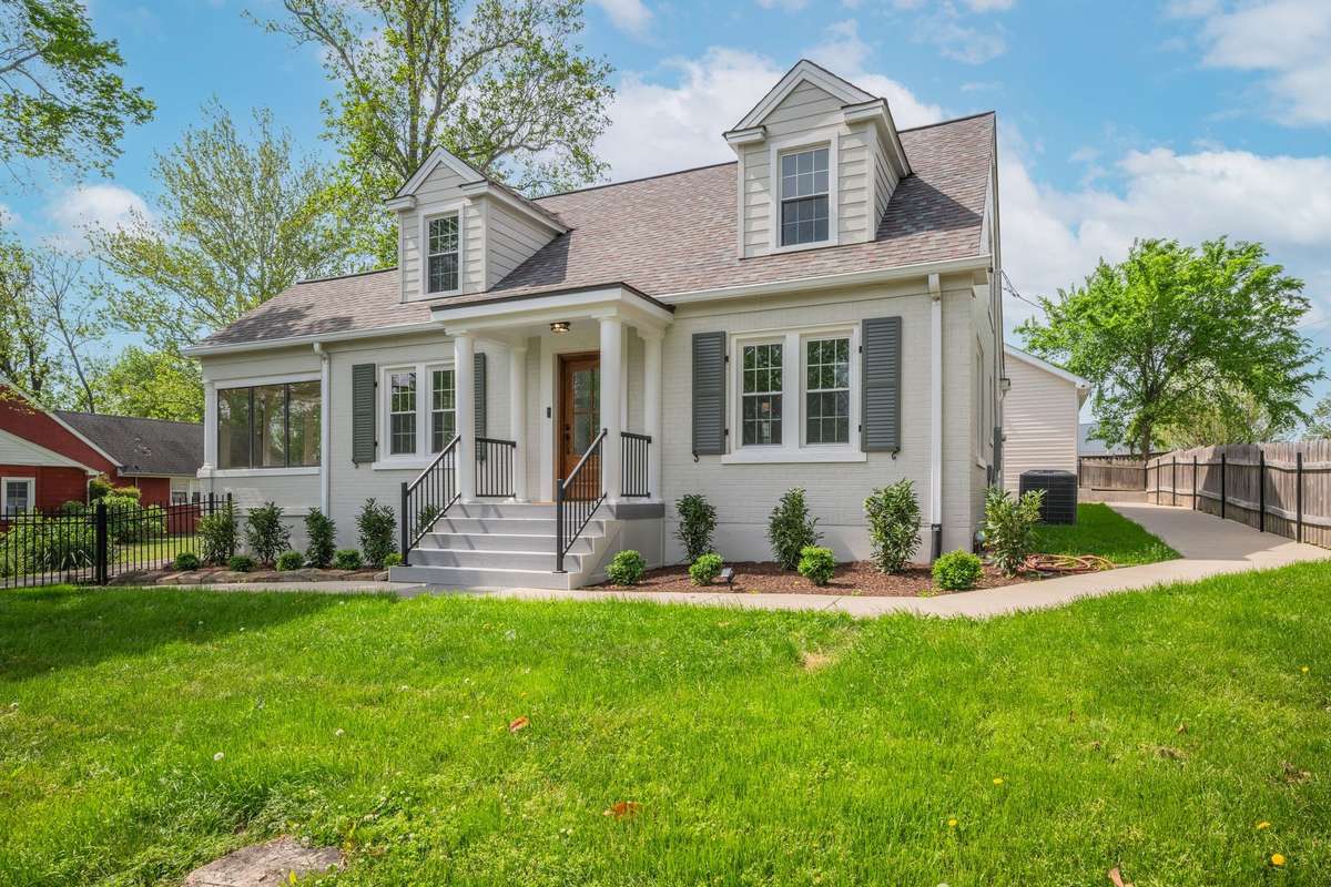 Two Story Full Brick with Sunroom * Sidewalks Surround the house with  Front and Side Entry to Front Porch