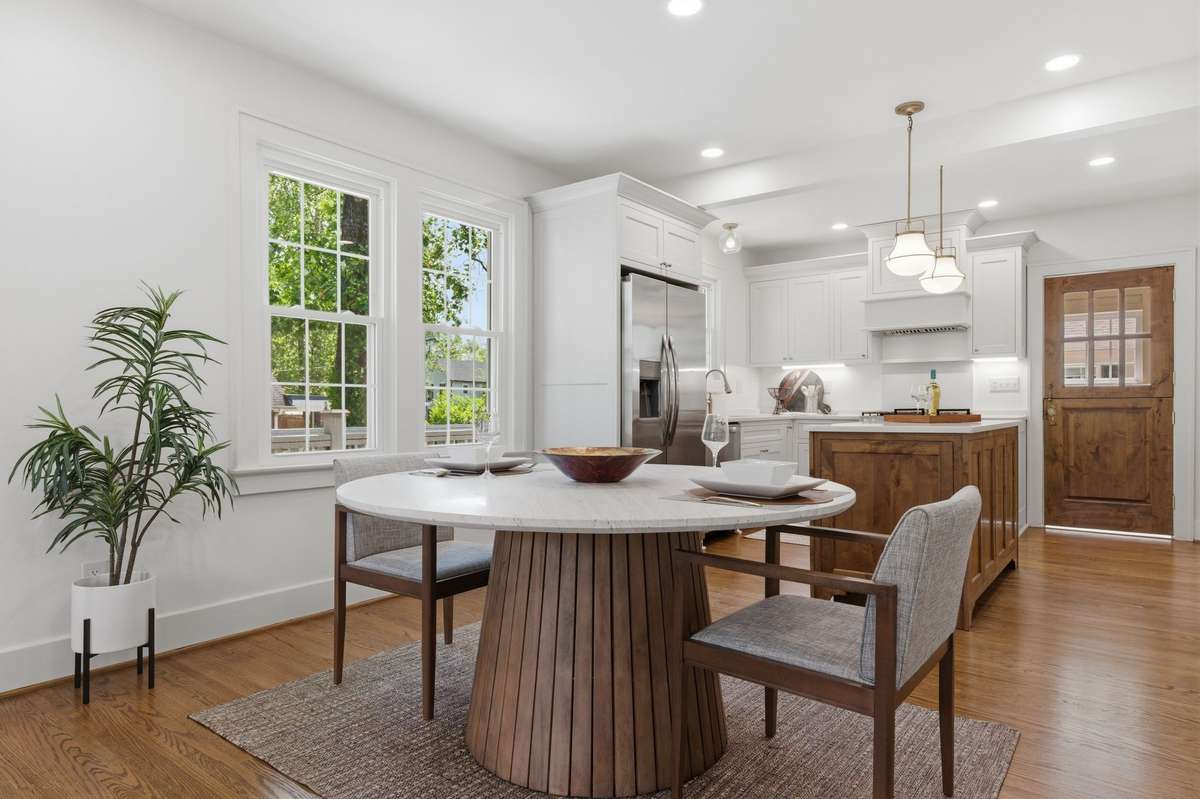 All the Special Touches of this home will exceed your expectations *The custom built back door -OH MY!  Thoughtfully Laid out kitchen with Island  accented by the Pendant Lights *Hardwood Floors