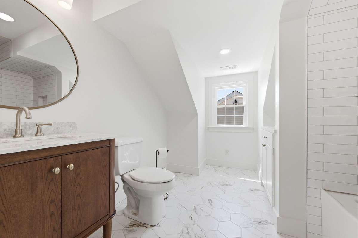 Love the Tile Flooring In this Full Bath * Vanity & Tub/ Shower Combo with Tile 
*Such a sweet space with back dormer offers wonderful light