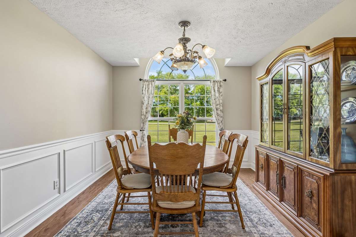 Kitchen and breakfast area with bright windows and charming details.