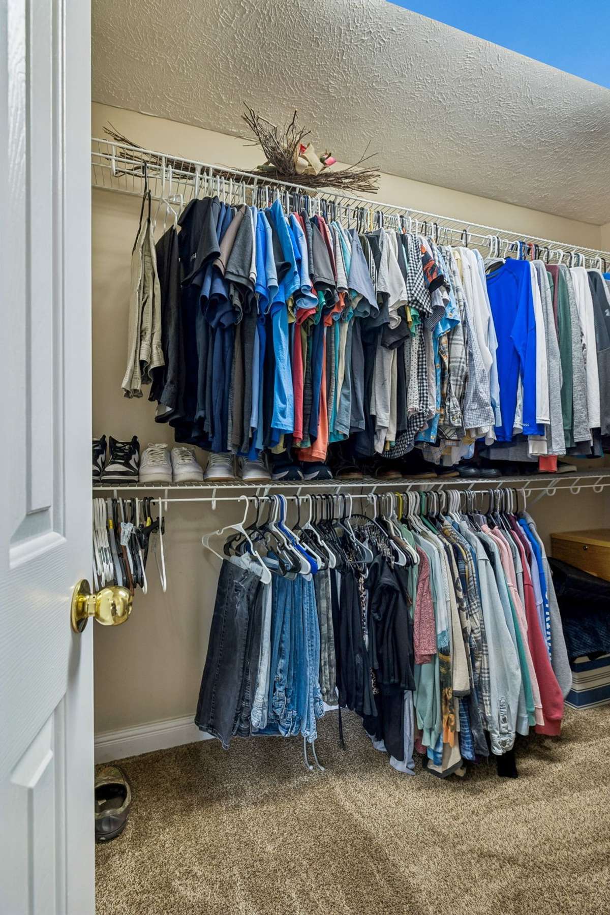 Walk-in closet with double hanging storage.