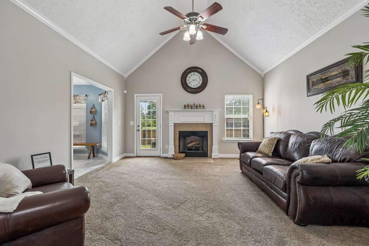 Spacious living room with high ceilings and comfortable layout.