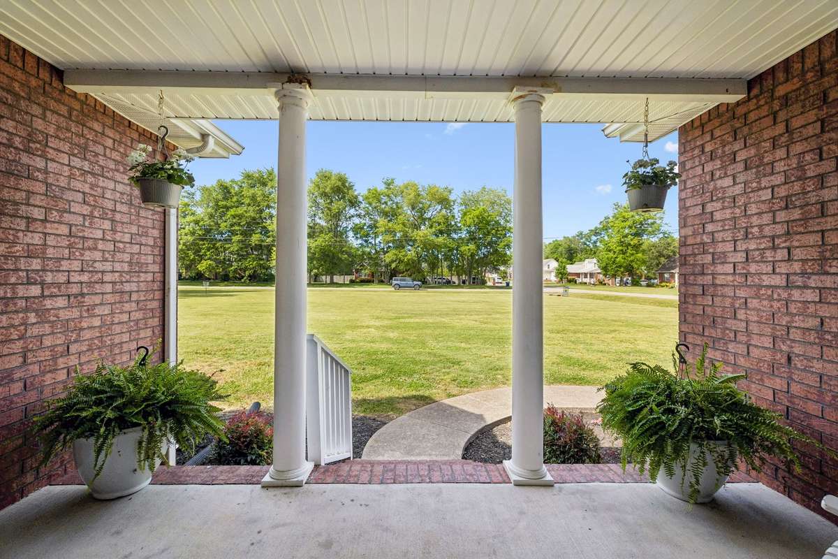 Front porch view overlooking the open front lawn.