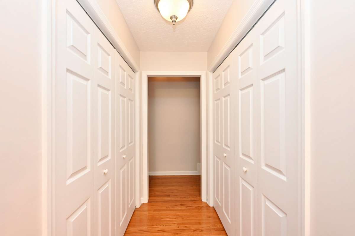 spacious pantry and washer/dryer hookups off kitchen, through this hallway are the bonus room and garage entries