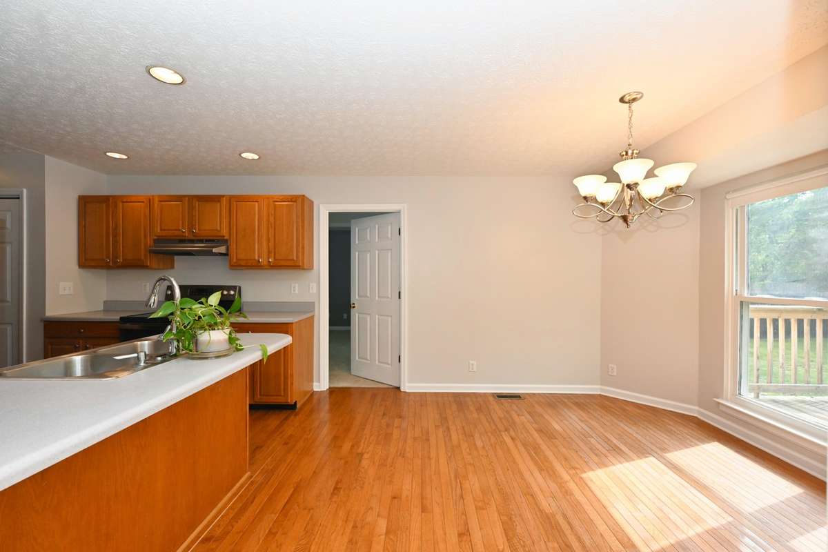 Home offers split bedroom floorplan with primary bedroom off kitchen