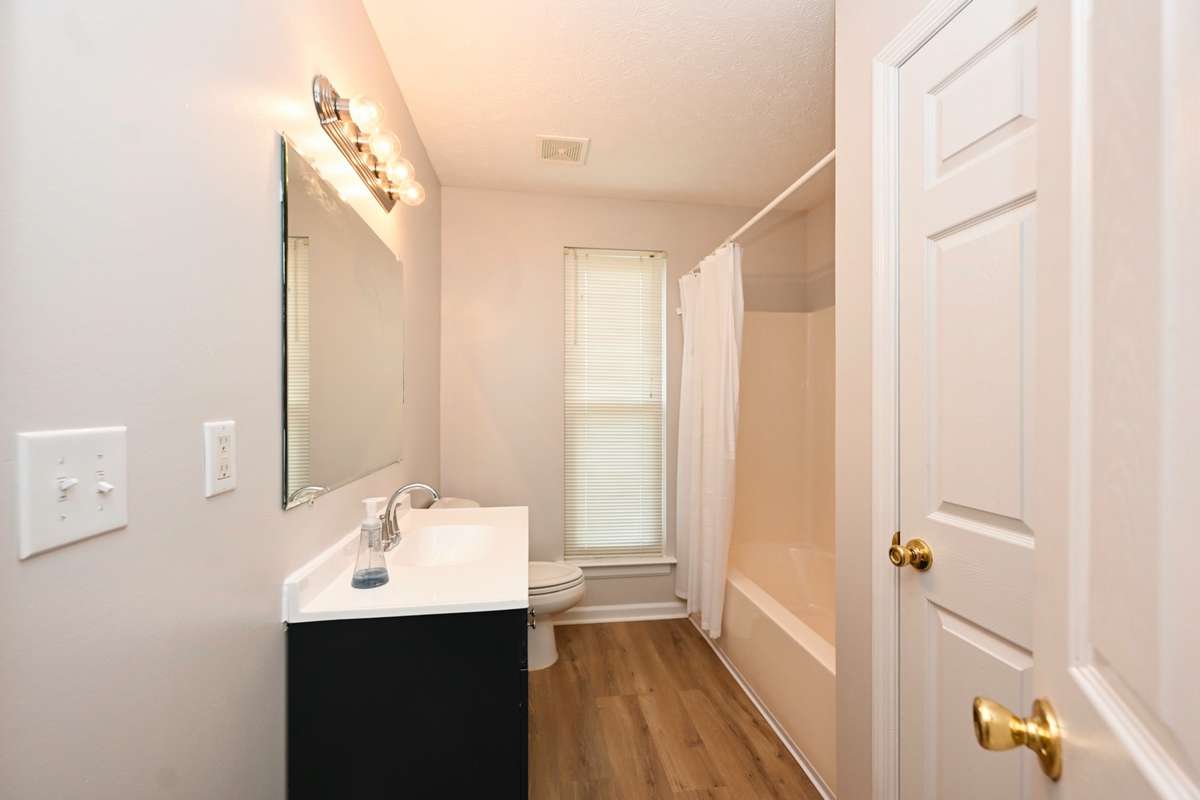 new vanity and flooring in hall bath plus fresh paint!