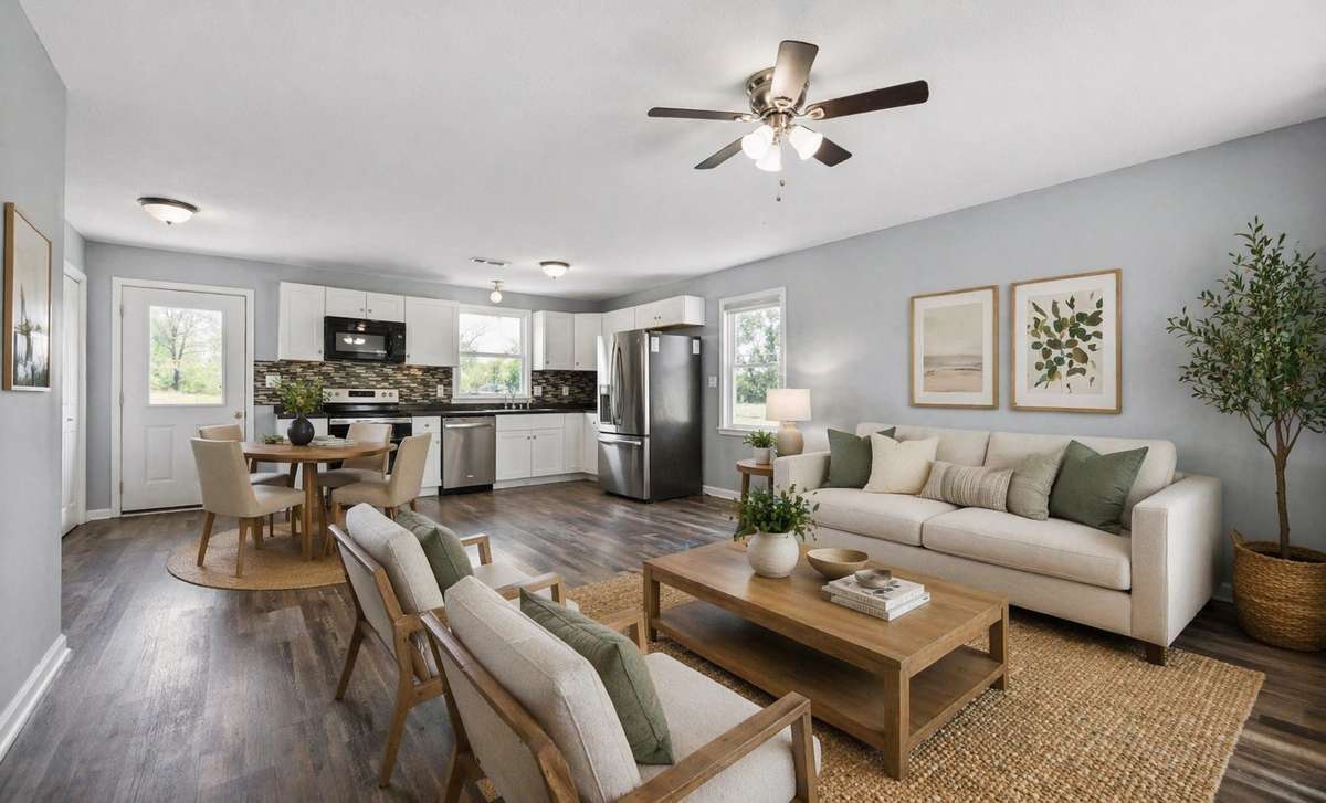 Virtually staged. There are multiple ways that you can set up this room due to it's open and flowing concept.